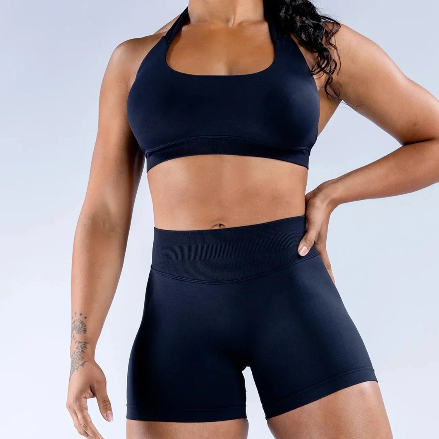 Elite Dynamic Impact Gym Set featuring a matching performance top and leggings with compression support, breathable fabric, and a sleek athletic design