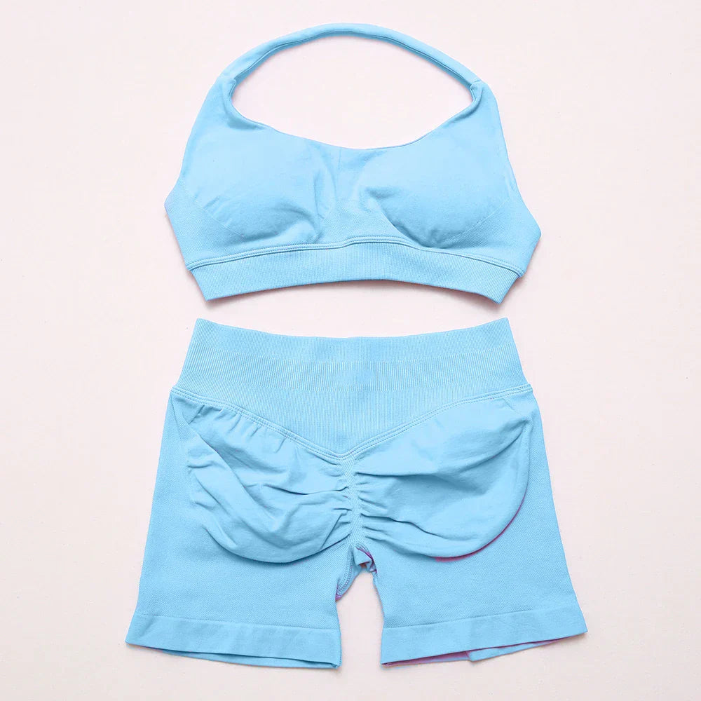 Elite Dynamic Impact Gym Set featuring a matching performance top and leggings with compression support, breathable fabric, and a sleek athletic design