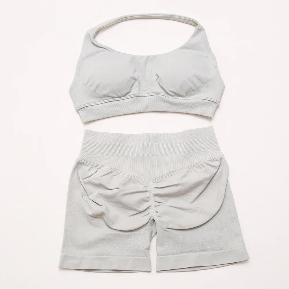 Elite Dynamic Impact Gym Set featuring a matching performance top and leggings with compression support, breathable fabric, and a sleek athletic design