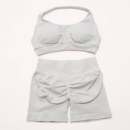 Elite Dynamic Impact Gym Set featuring a matching performance top and leggings with compression support, breathable fabric, and a sleek athletic design