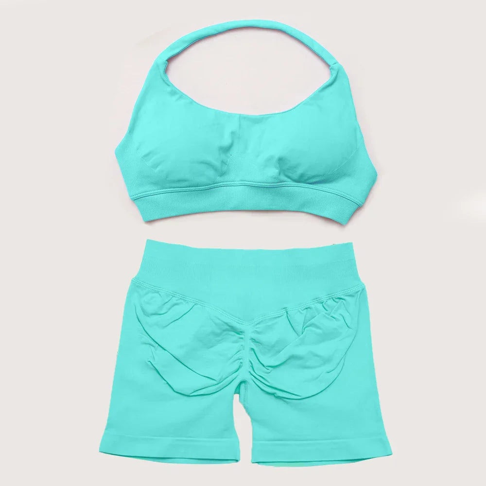 Elite Dynamic Impact Gym Set featuring a matching performance top and leggings with compression support, breathable fabric, and a sleek athletic design