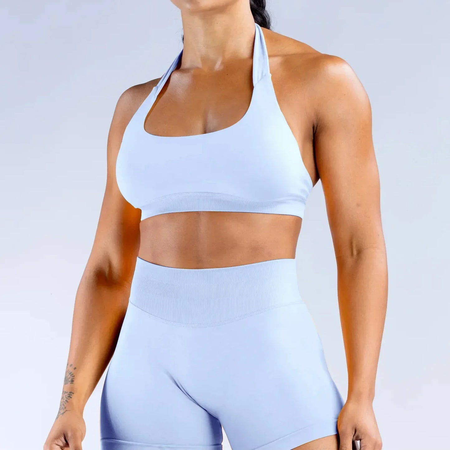 Elite Dynamic Impact Gym Set featuring a matching performance top and leggings with compression support, breathable fabric, and a sleek athletic design