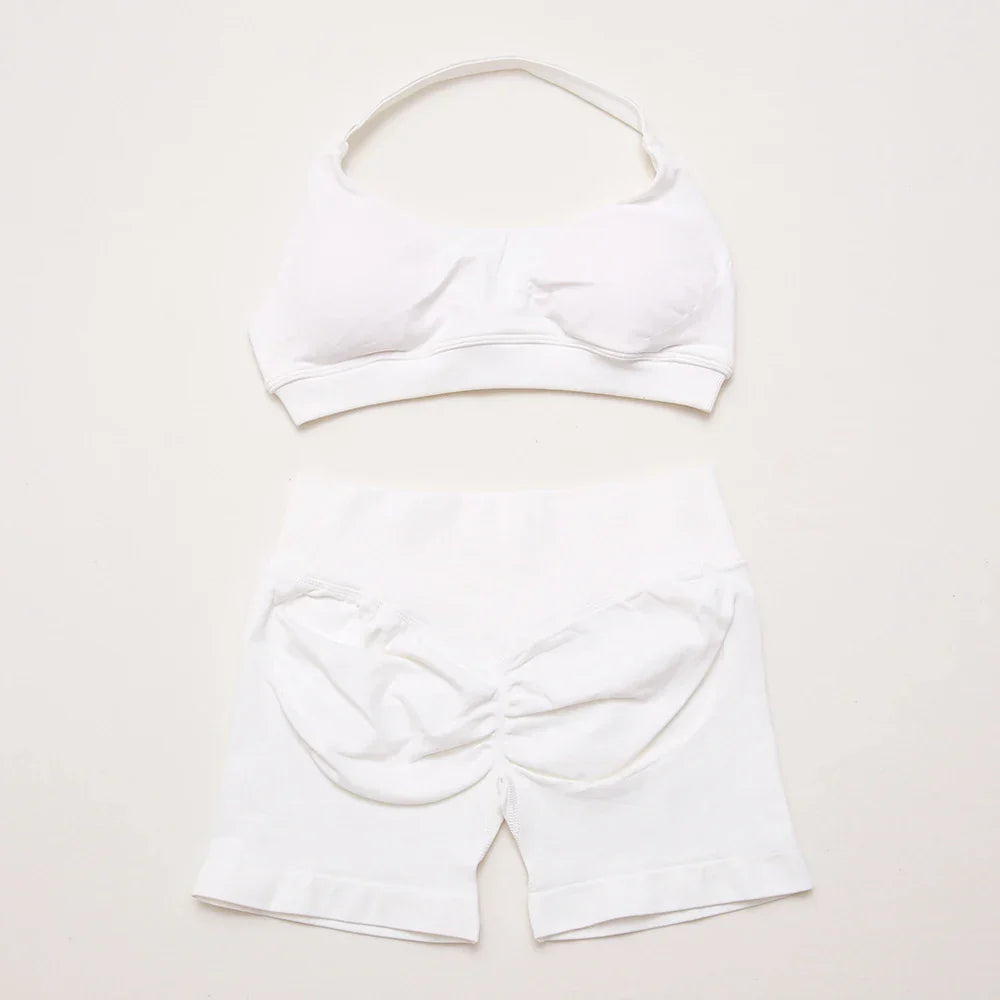 Elite Dynamic Impact Gym Set featuring a matching performance top and leggings with compression support, breathable fabric, and a sleek athletic design