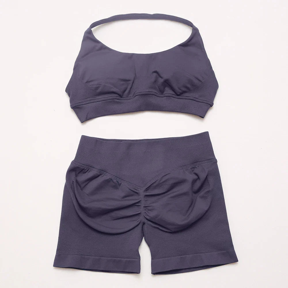 Elite Dynamic Impact Gym Set featuring a matching performance top and leggings with compression support, breathable fabric, and a sleek athletic design