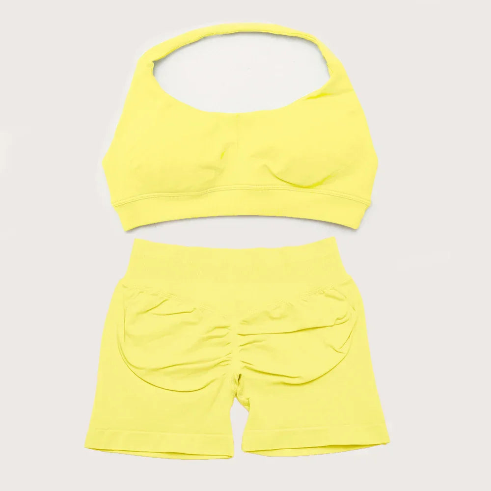 Elite Dynamic Impact Gym Set featuring a matching performance top and leggings with compression support, breathable fabric, and a sleek athletic design