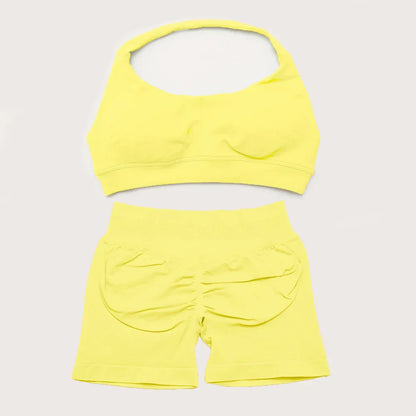 Elite Dynamic Impact Gym Set featuring a matching performance top and leggings with compression support, breathable fabric, and a sleek athletic design