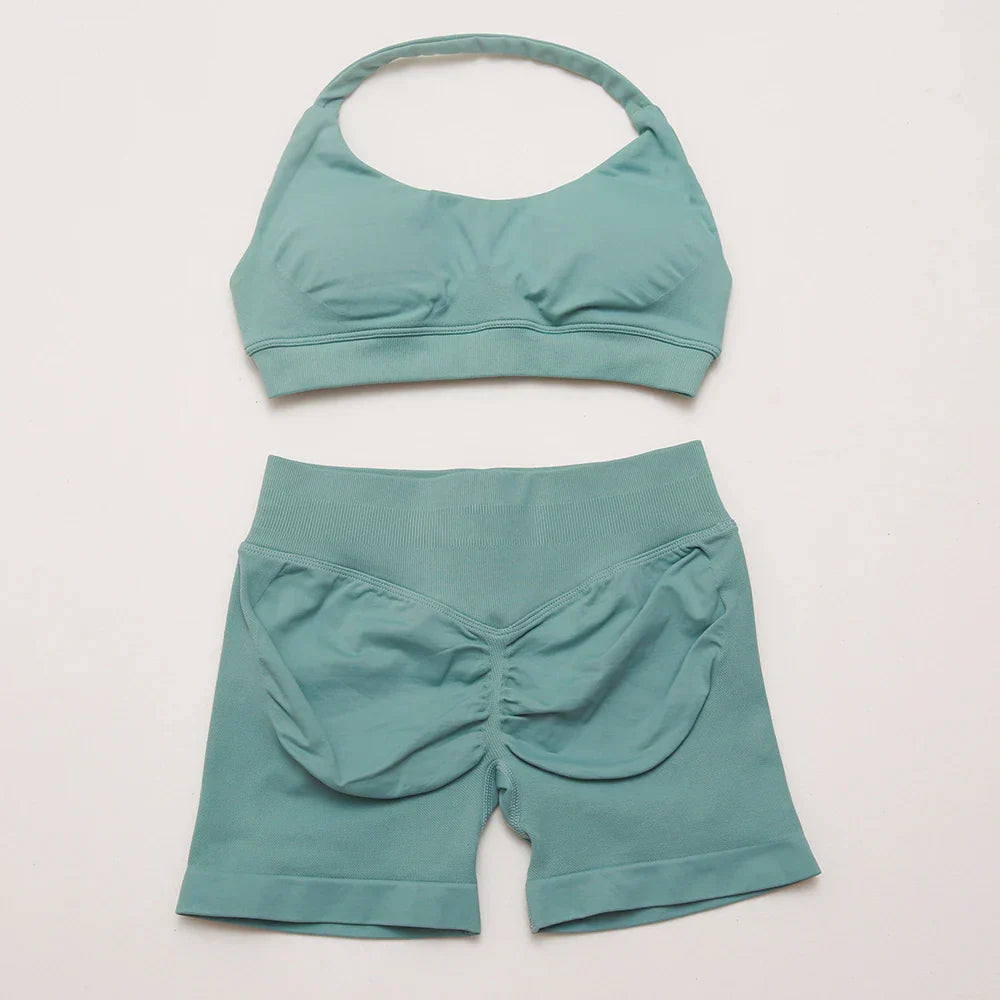 Elite Dynamic Impact Gym Set featuring a matching performance top and leggings with compression support, breathable fabric, and a sleek athletic design