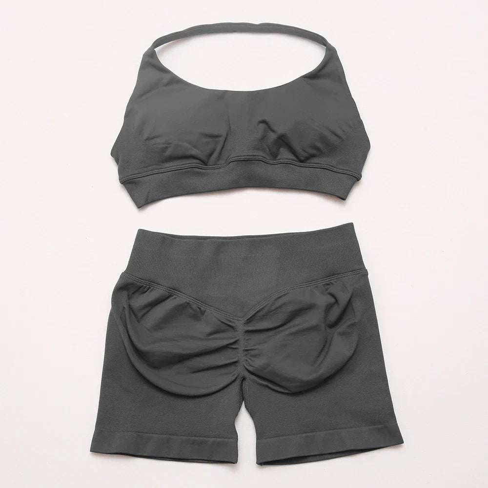 Elite Dynamic Impact Gym Set featuring a matching performance top and leggings with compression support, breathable fabric, and a sleek athletic design