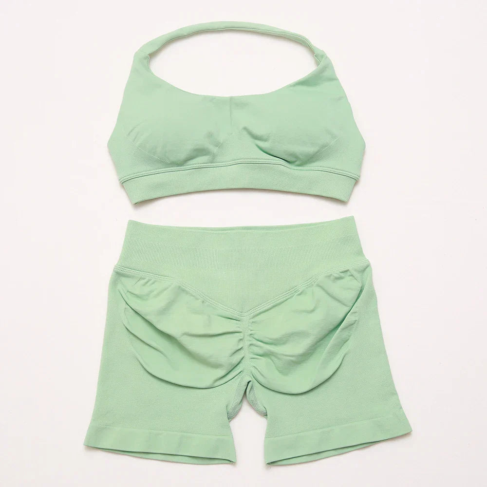 Elite Dynamic Impact Gym Set featuring a matching performance top and leggings with compression support, breathable fabric, and a sleek athletic design