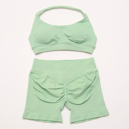 Elite Dynamic Impact Gym Set featuring a matching performance top and leggings with compression support, breathable fabric, and a sleek athletic design