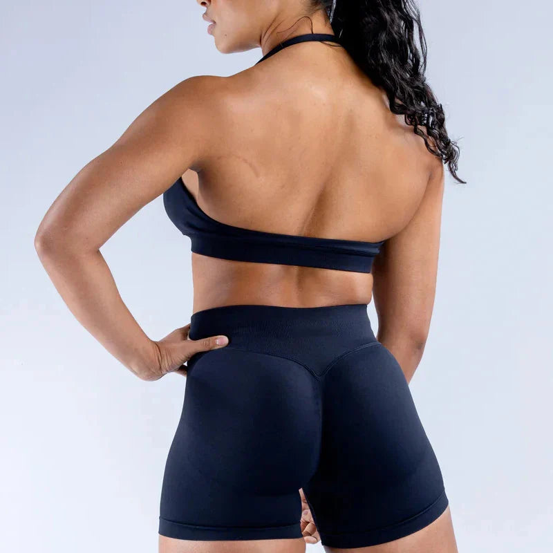 Elite Dynamic Impact Gym Set featuring a matching performance top and leggings with compression support, breathable fabric, and a sleek athletic design