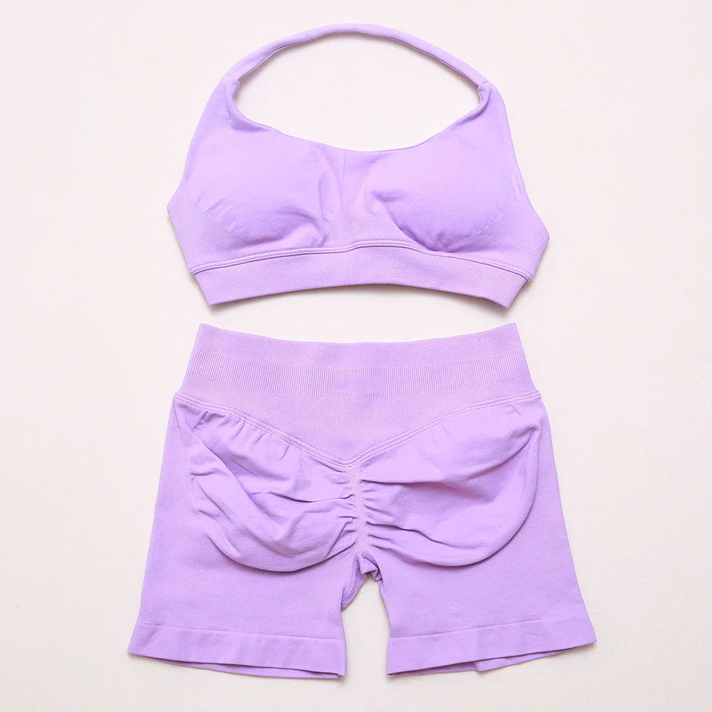 Elite Dynamic Impact Gym Set featuring a matching performance top and leggings with compression support, breathable fabric, and a sleek athletic design